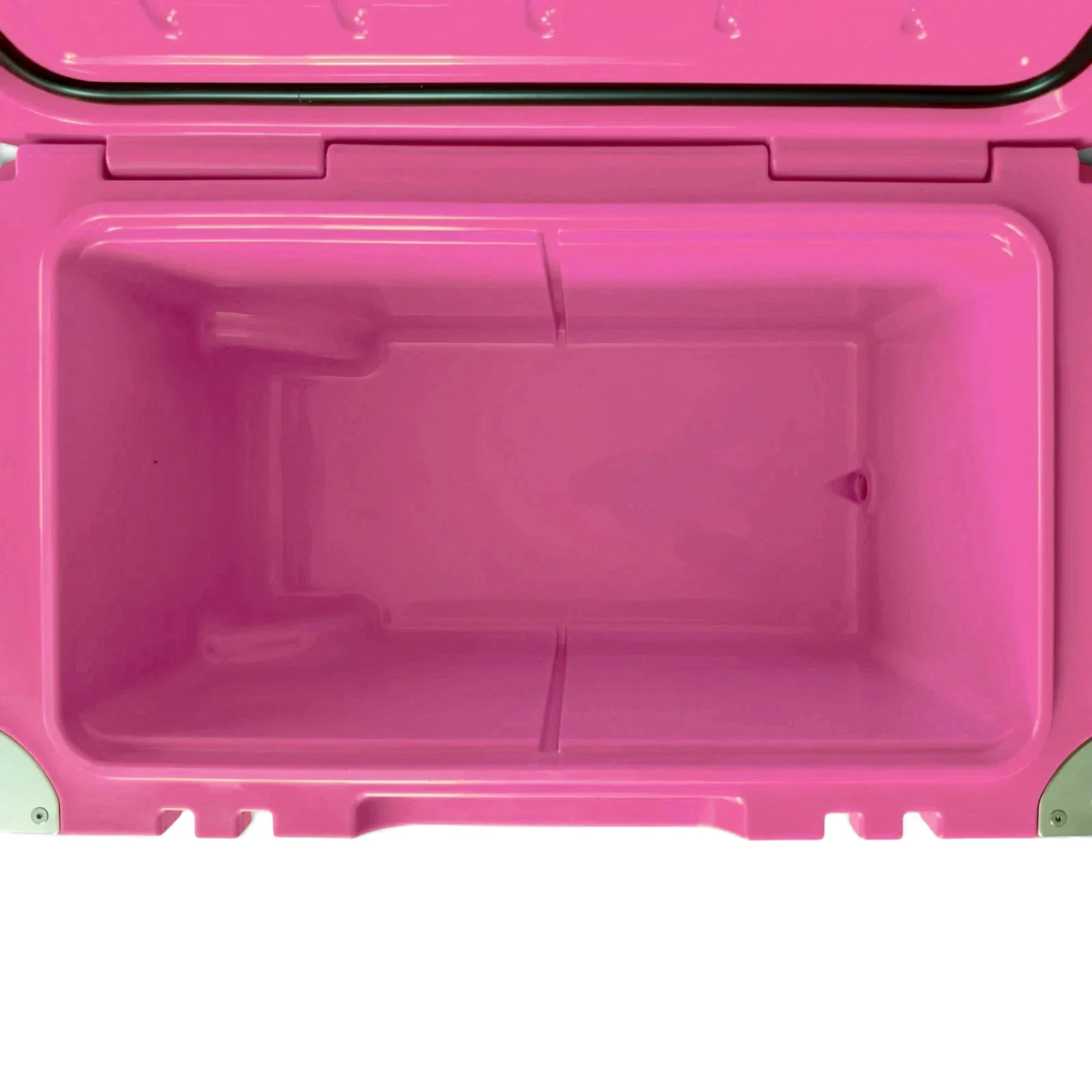 Empty interior of the pink Orbie 55 cool box, showing the moulded basket rails and the drain outlet