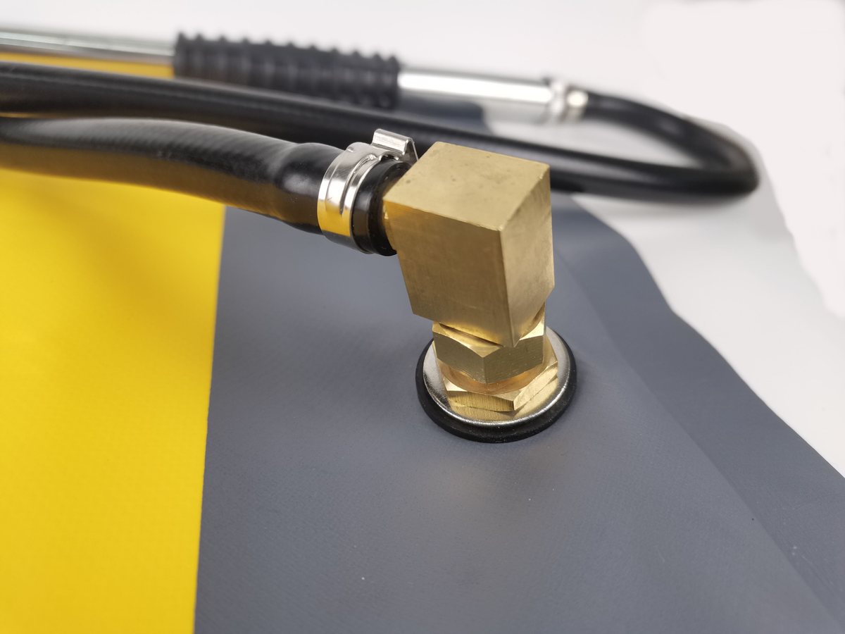 Brass outlet fitting and hose clip at the base of the Bush Fire Aqua Backpack