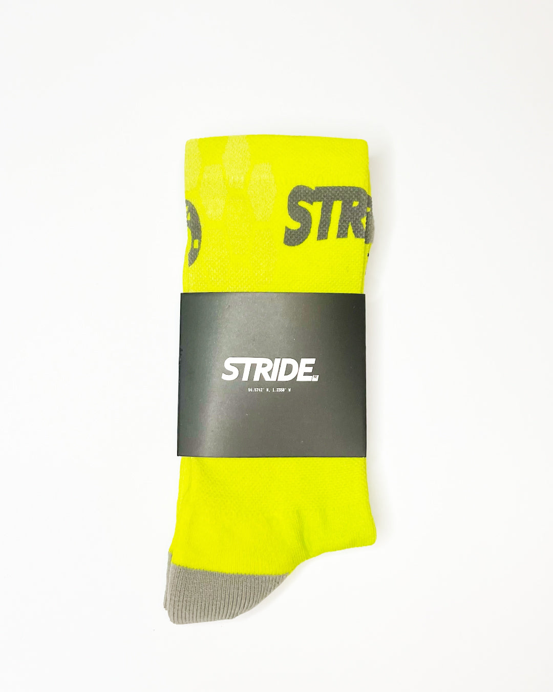 Stride Citron Chase running sock folded in its black STRIDE card sleeve
