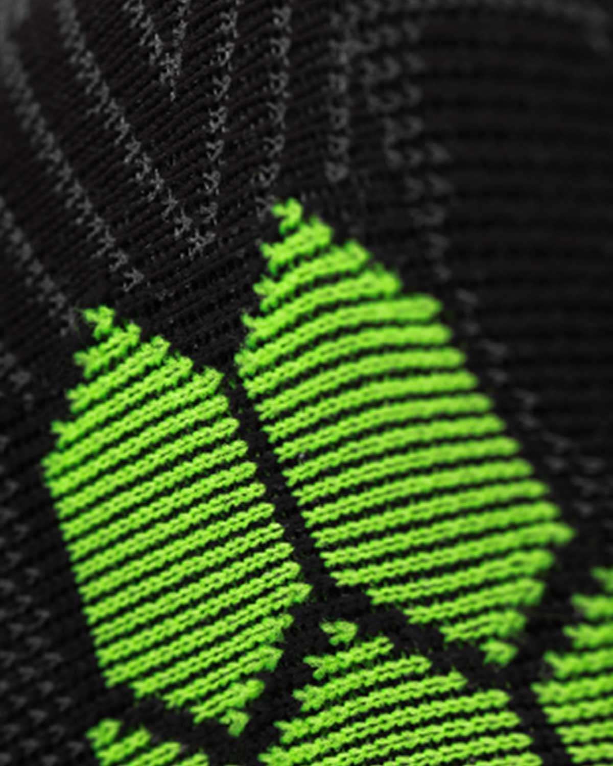 Close-up of the Enertor Energy Run sock knit and green honeycomb panel