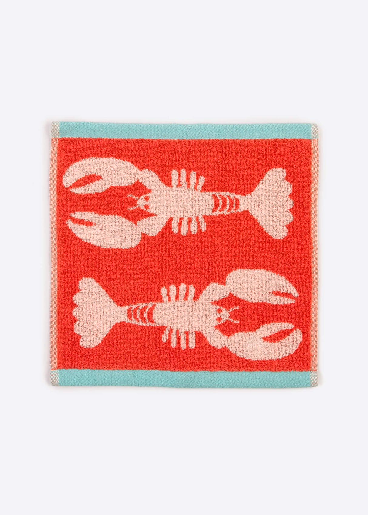 Anorak Lobsters Organic Cotton Towel - Coral and pink face cloth flat lay