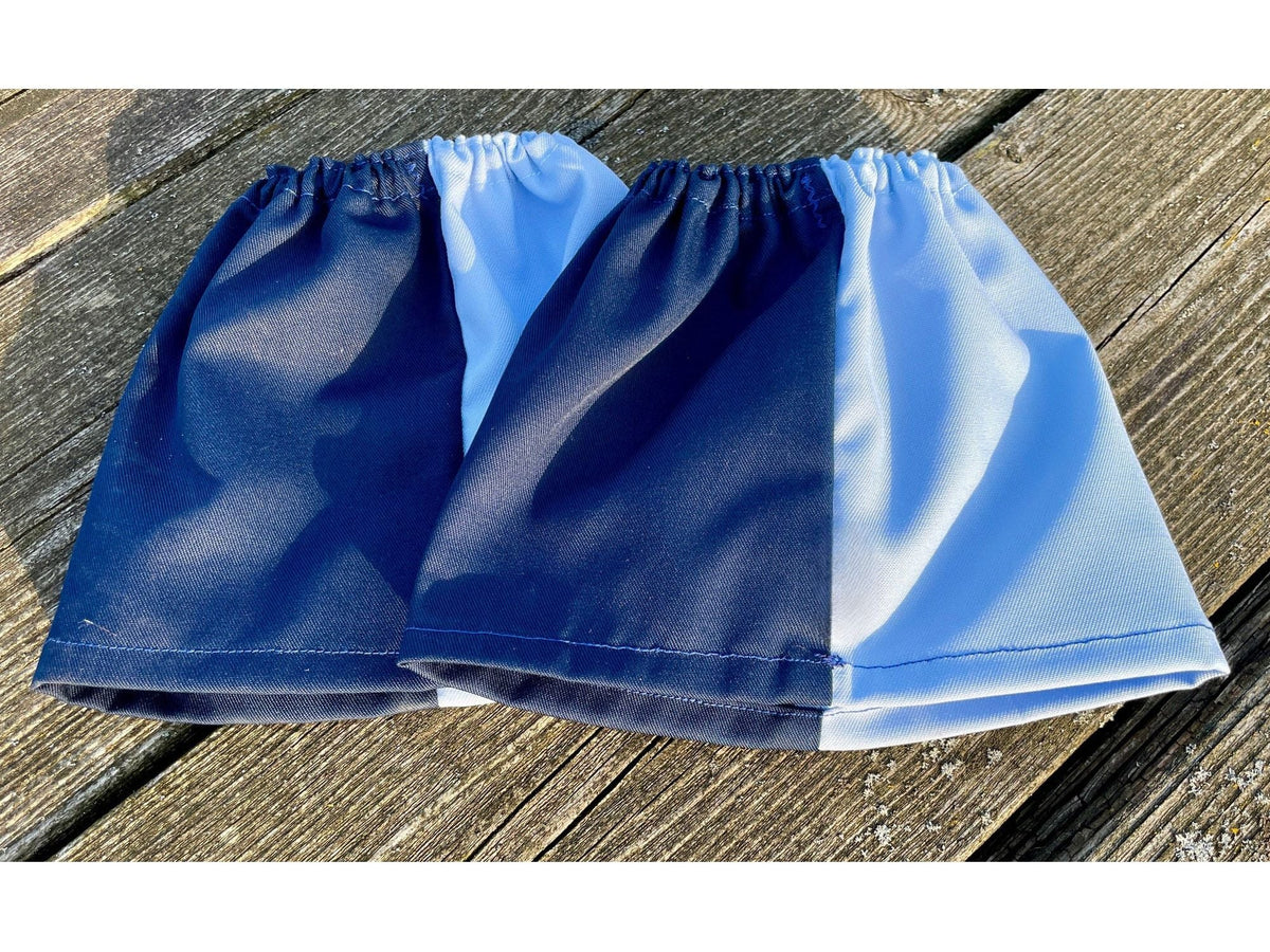 Pair of navy and sky blue harlequin sox savers laid flat on decking
