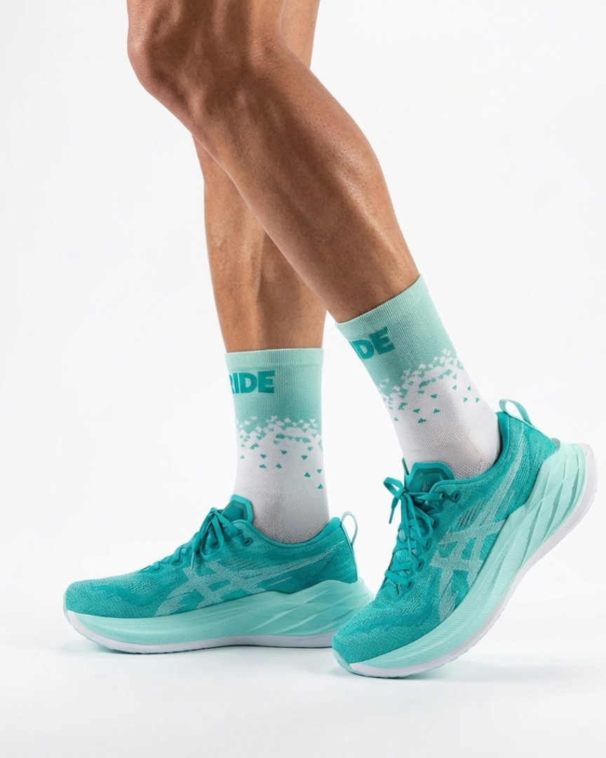 Runner's lower legs in Stride Jade Force half crew running socks with teal running shoes