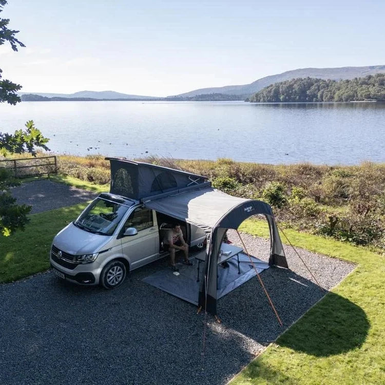 Vango Sunlight Air canopy on a campervan pitched beside a lake