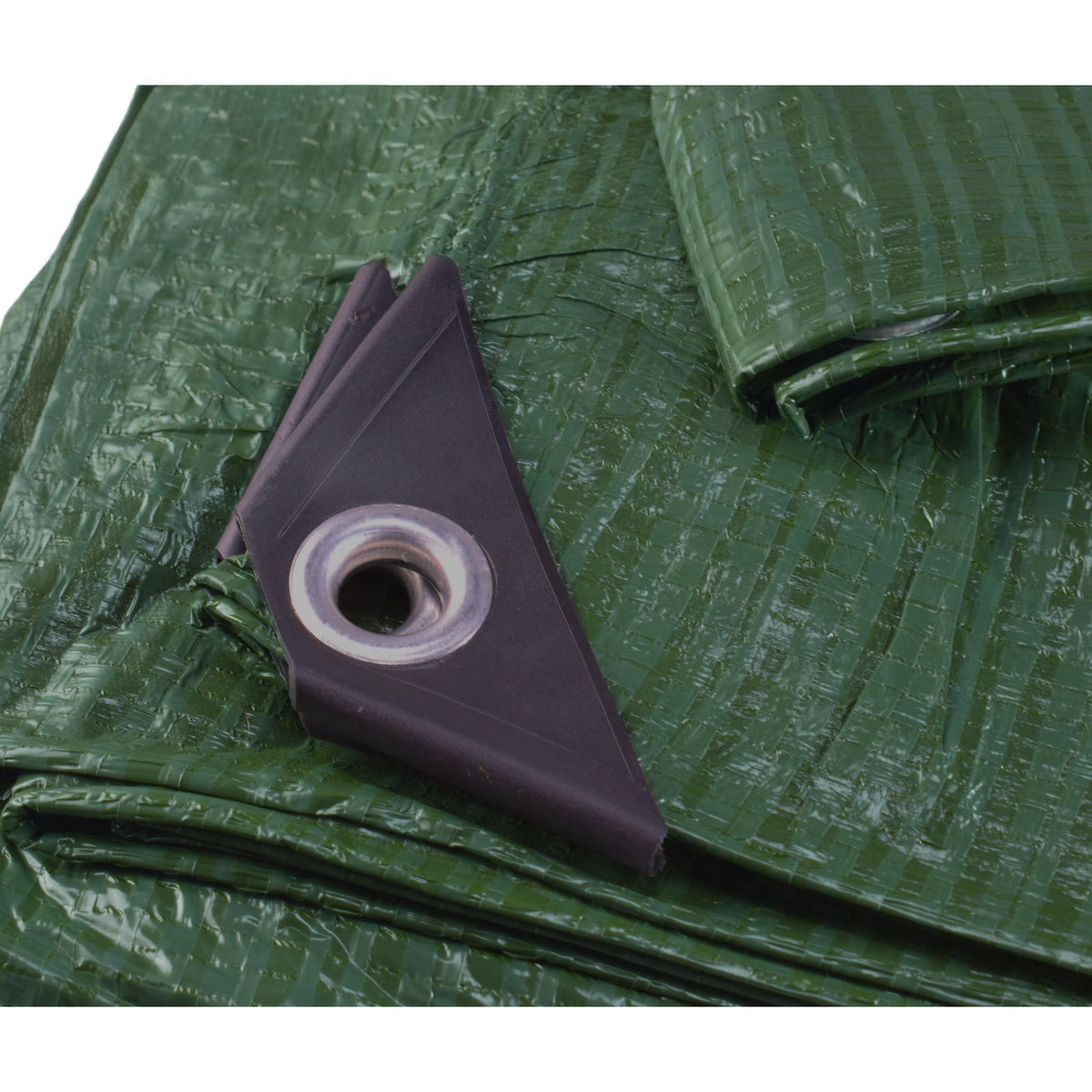 Green S-Grade Tarpaulin 4m x 6m folded into a flat bundle, side view