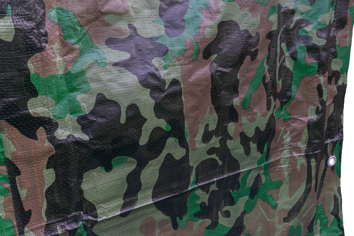 Close-up of a fold in the Camouflage M-Grade Tarpaulin 1m x 1m with an eyelet