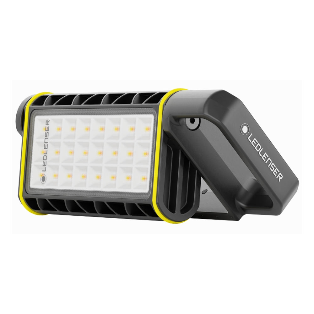 Ledlenser AF4R Work area light angled on its fold-out handle, showing the grid of warm and cool white LEDs