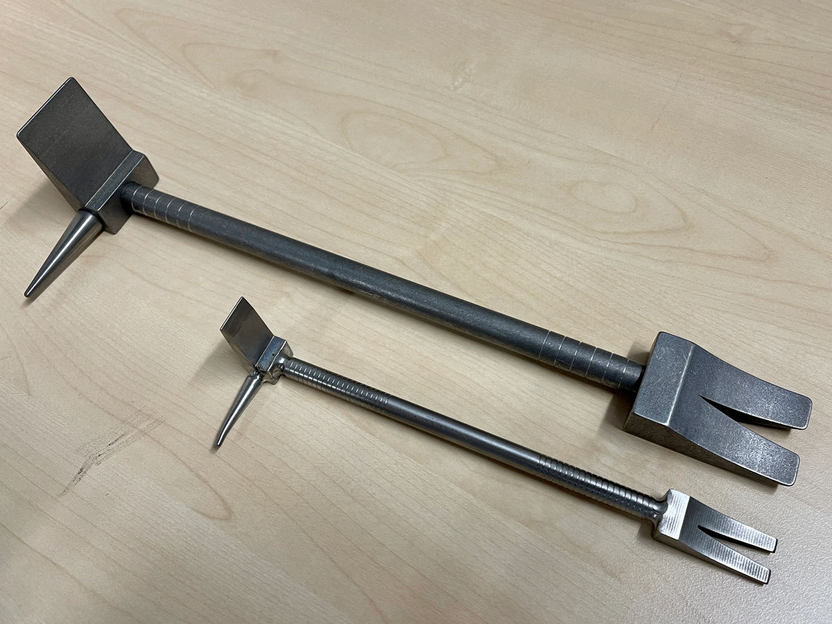 12 in and 8 in Titanium Hooligan Bars side by side on a wooden table