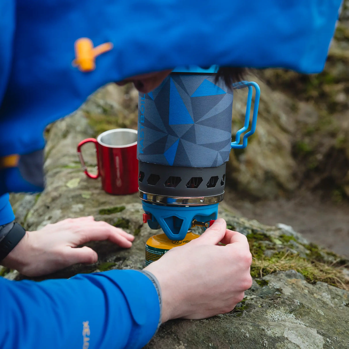 Highlander Blade Fastboil 3 Camping Gas Stove 1.1L in blue lifestyle for camping