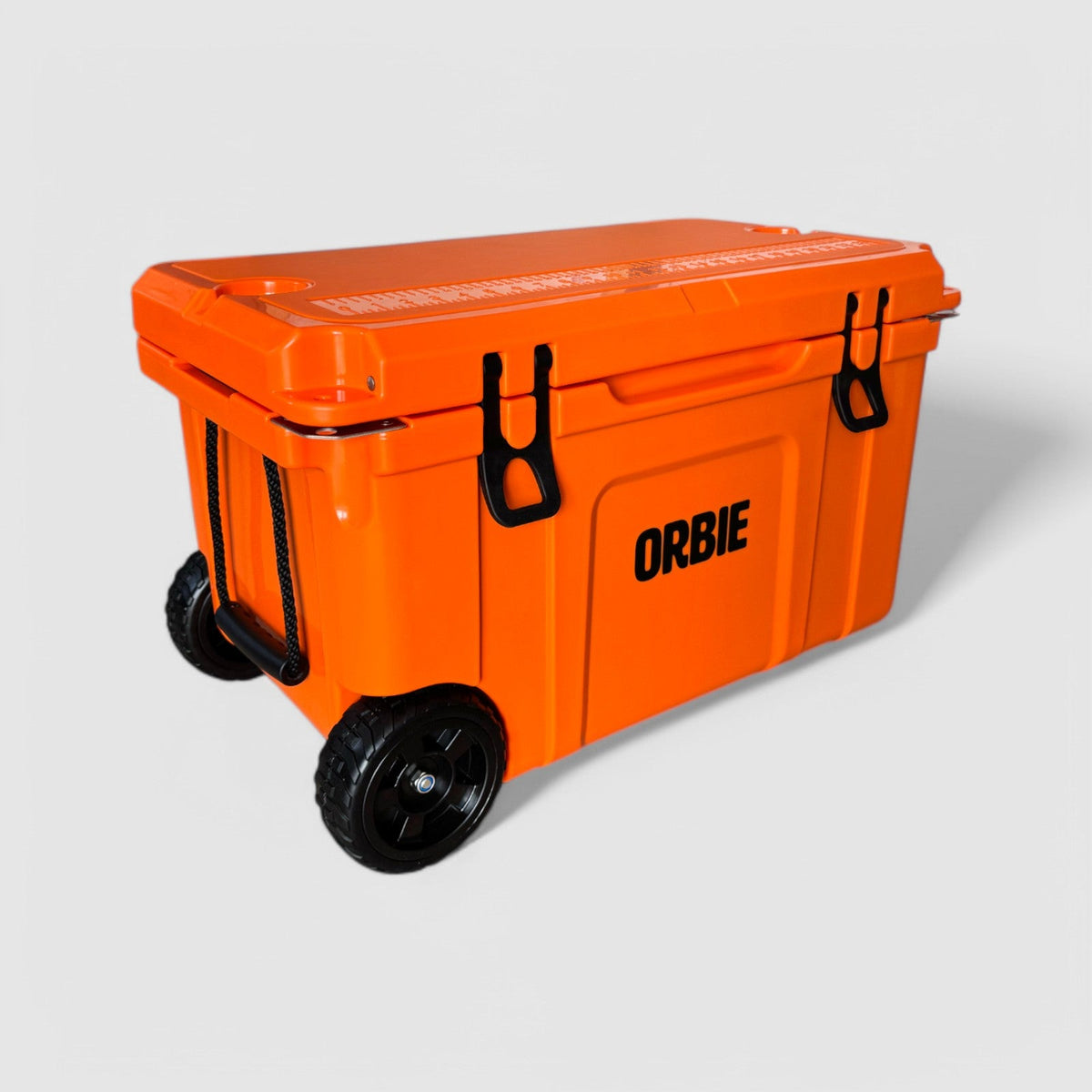 Orbie 55 wheeled cool box in orange from above at an angle, showing the lid ruler and two moulded cup holders