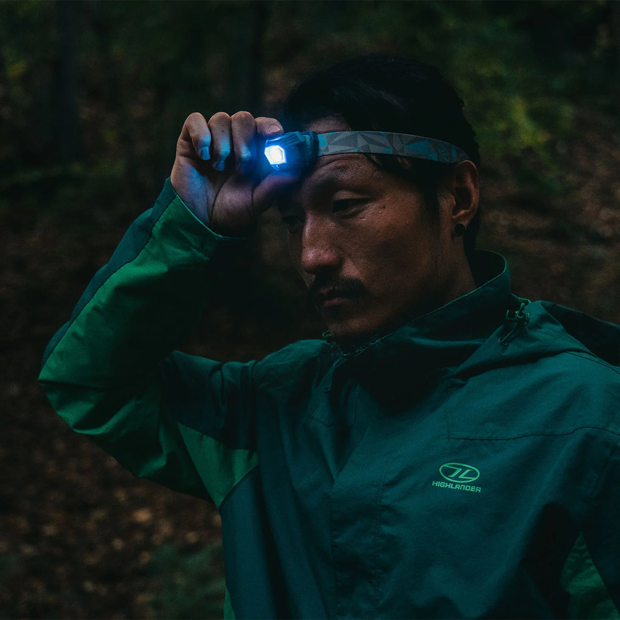 Highlander Deneb Sensor Rechargeable Head Torch in the outdoors for hiking