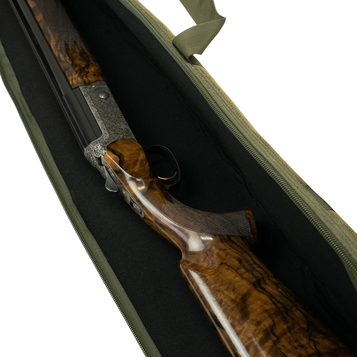 Engraved shotgun action and figured walnut stock in the black lining of the green Duotex slip