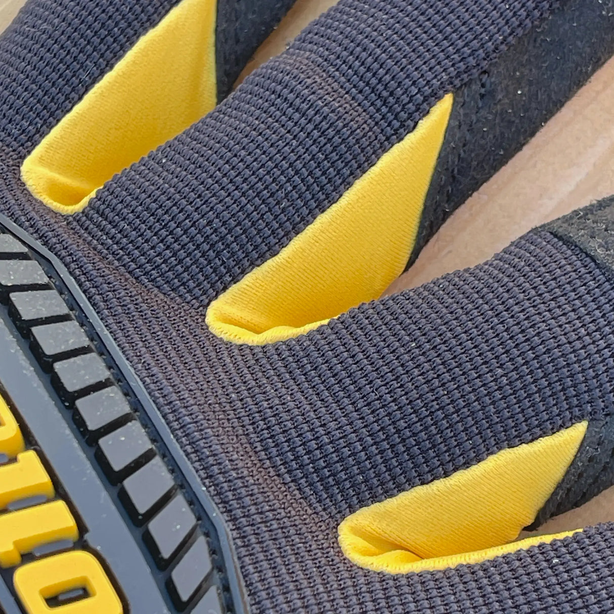 Ironclad Framer Gloves - back of hand view showing yellow synthetic leather in between fingers