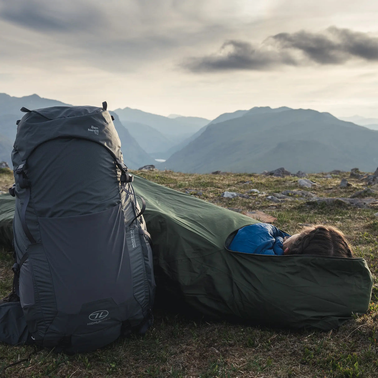 Highlander Hawk Waterproof Bivvy Bag being used outdoors - for survival