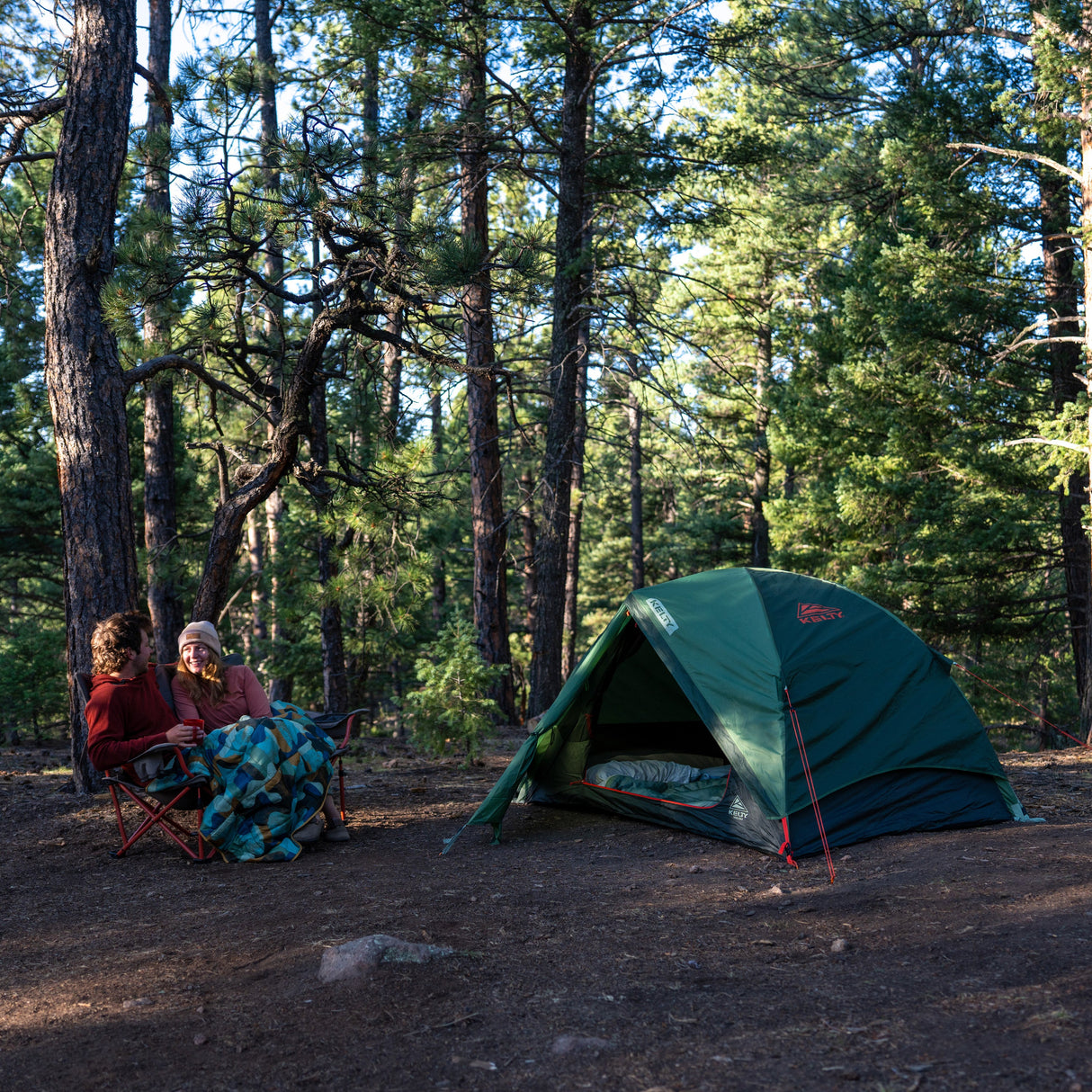 Kelty Wireless 2P Tent - Dill Black Forest pitched at a woodland campsite