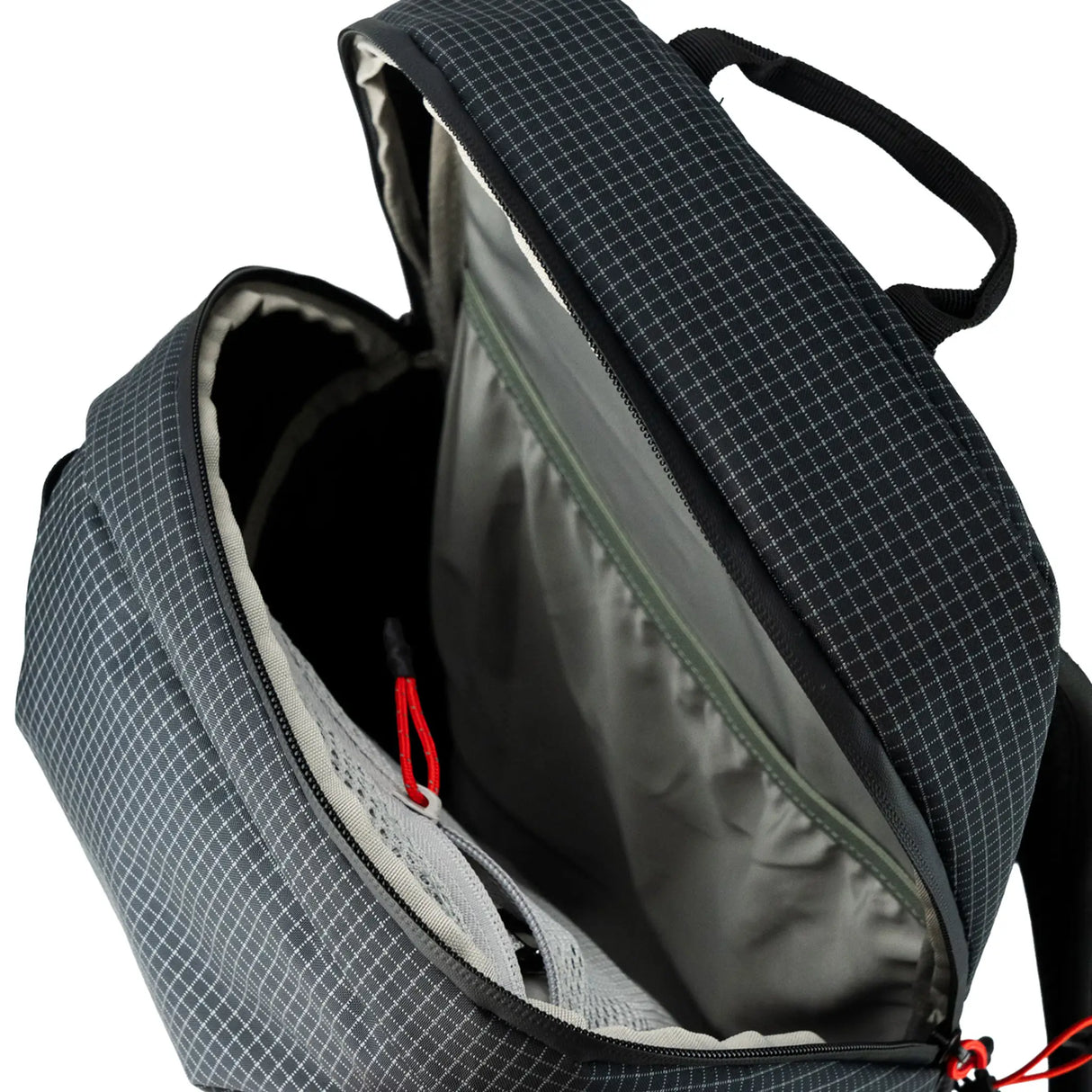 Highlander Kynetik Rucksack 15L in Black - main compartment unzipped showing the grey lining and internal sleeve
