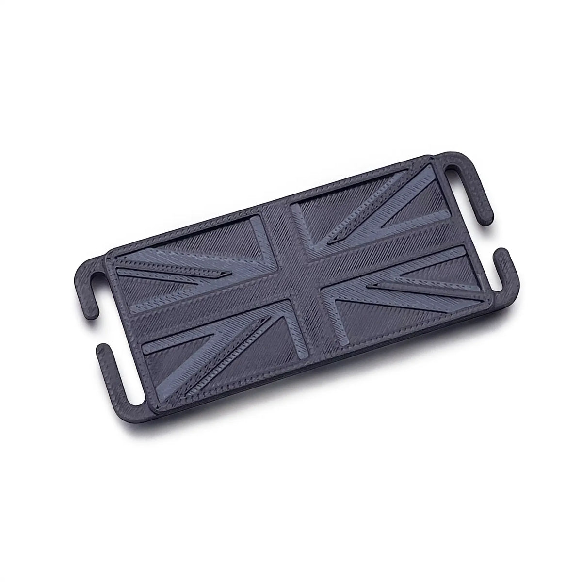 Black mini Union Jack MOLLE patch at an angle, showing the raised tone-on-tone flag