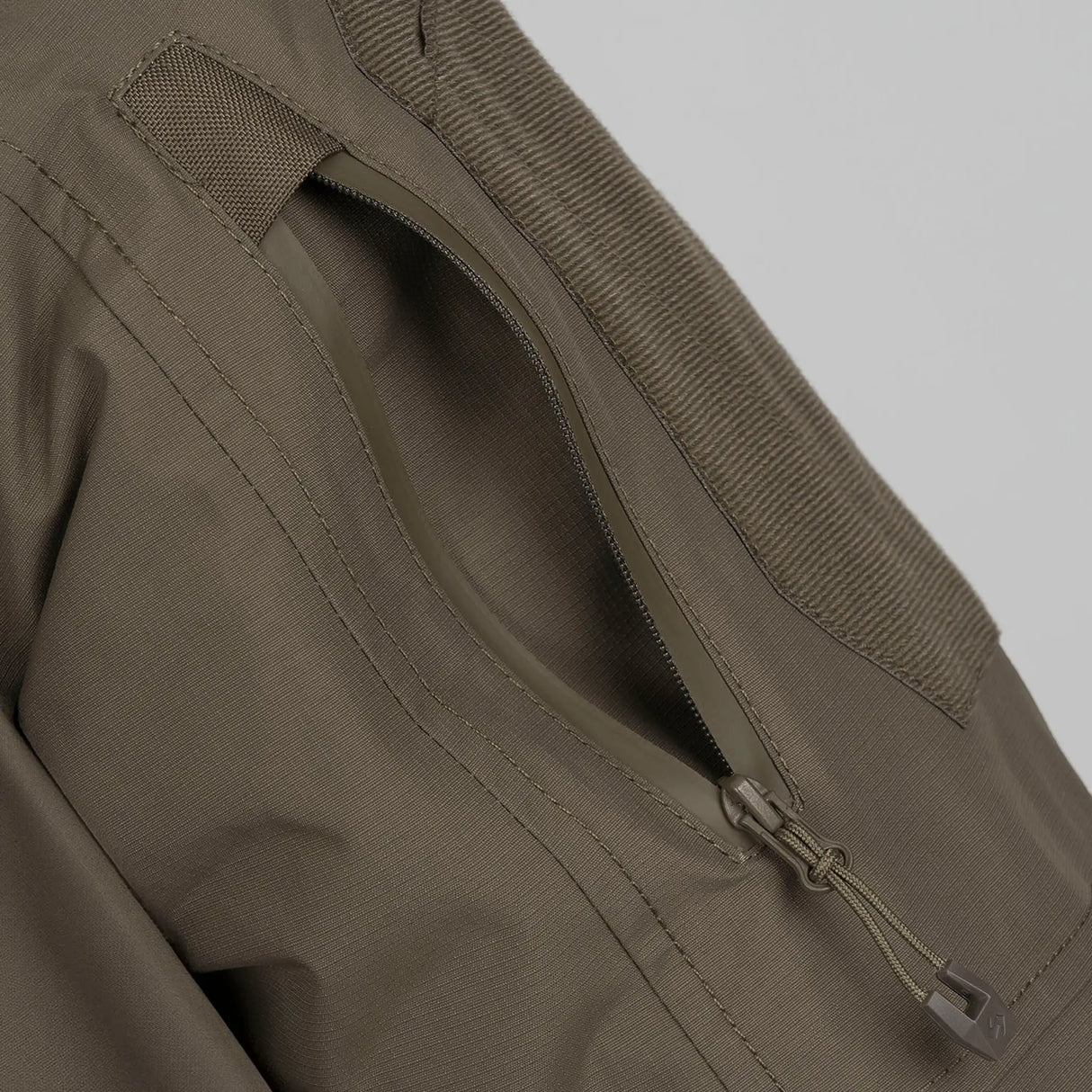 Stoirm Mission Primaloft All Weather Jacket in Ranger Green close up of the arm pocket