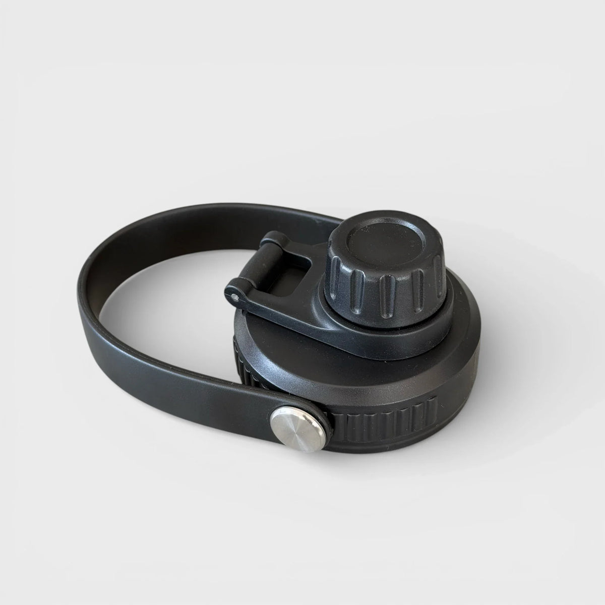 Orbie bottle chug lid closed, showing the ribbed screw cap, flip lever and moulded strap handle