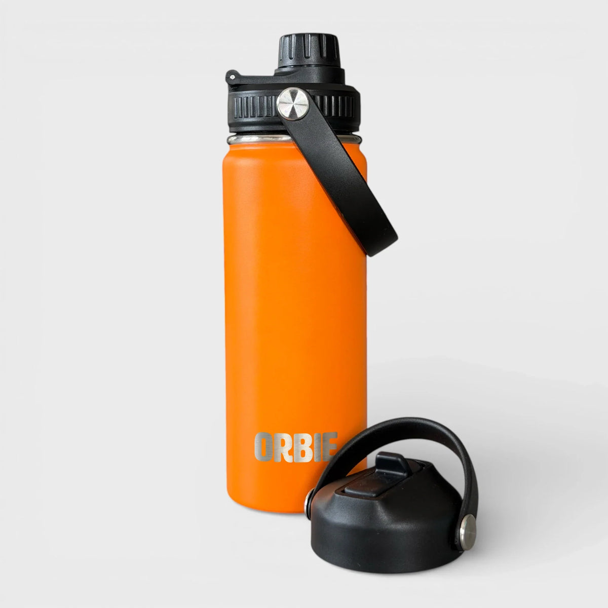 Orbie 18oz insulated water bottle in orange with the chug lid fitted and the sip lid standing alongside