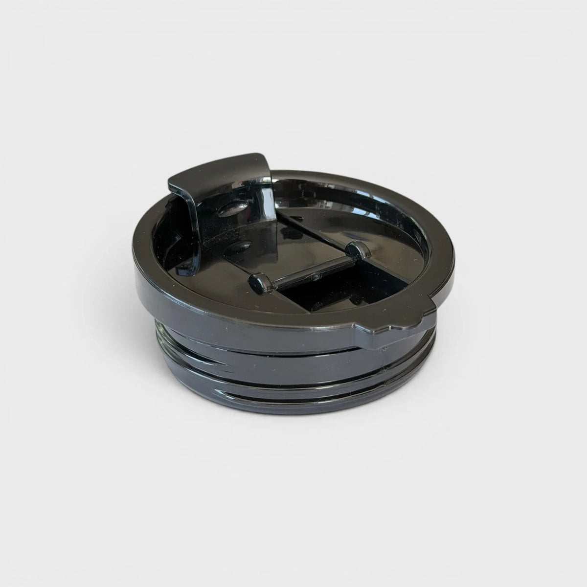 Black flip-top sip lid supplied with the Orbie 12oz insulated cup