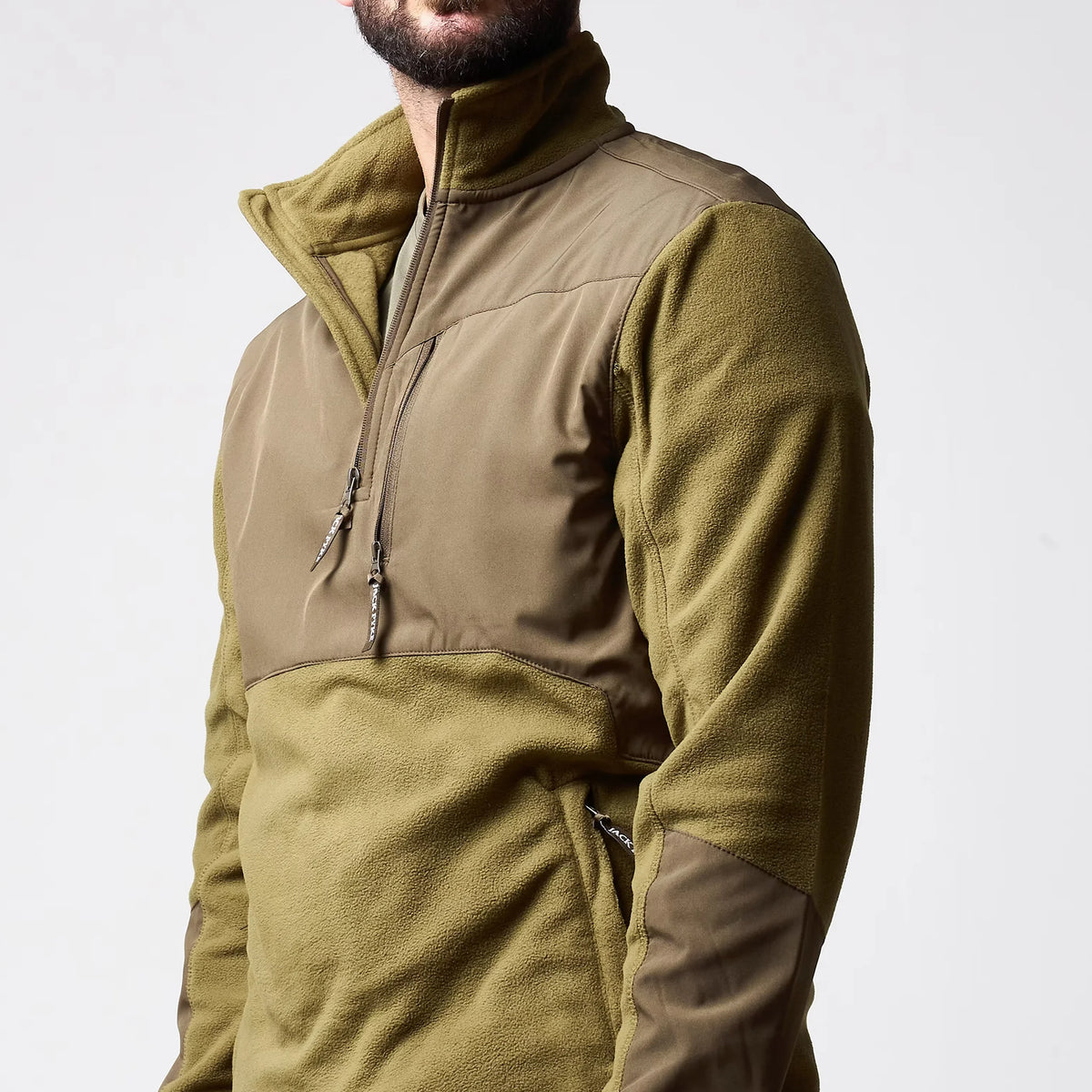 Jack Pyke Rannock Fleece Pullover in dark mustard, close-up with the 1/4 zip undone and the fleece-lined collar folded open