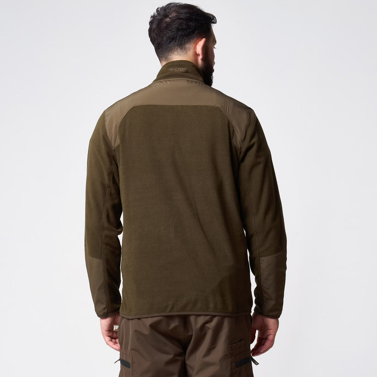 Jack Pyke Rannock Fleece Pullover in dark olive worn by a model, back view showing the smooth contrast panels across the shoulders and forearms