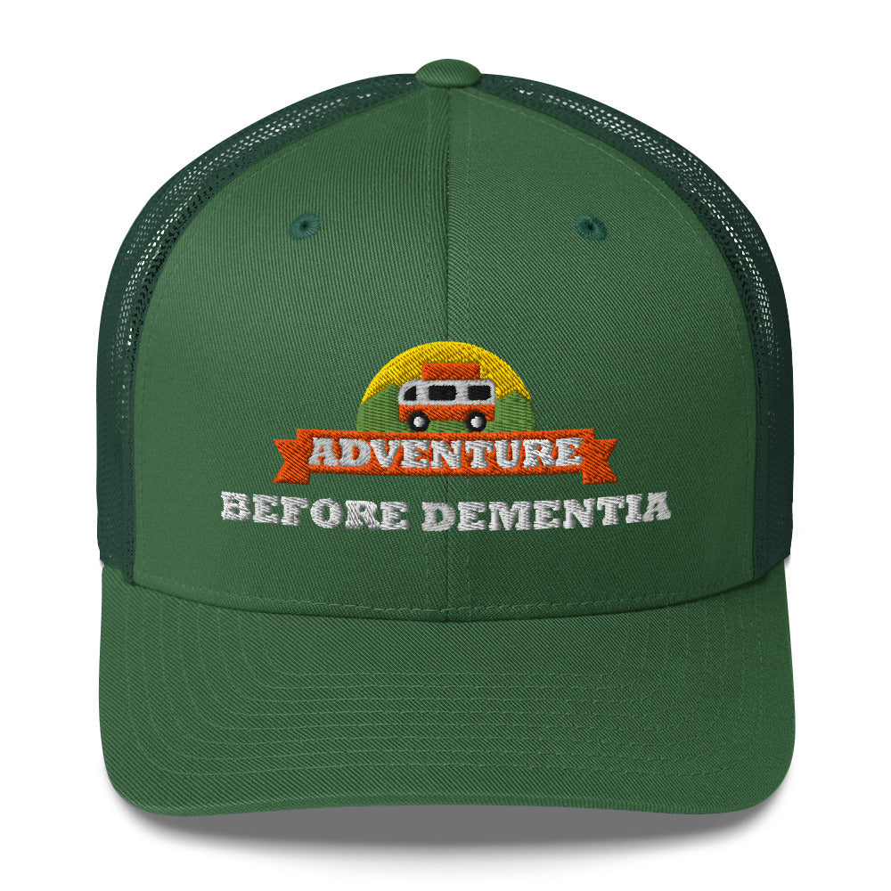 Adventure Before Dementia Trucker Cap in Evergreen, front view of the embroidered badge