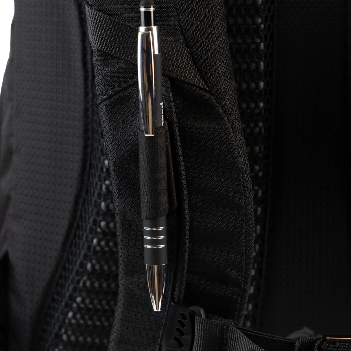 Highlander Roam Backpack 28L in black close up of the pen holder on white background