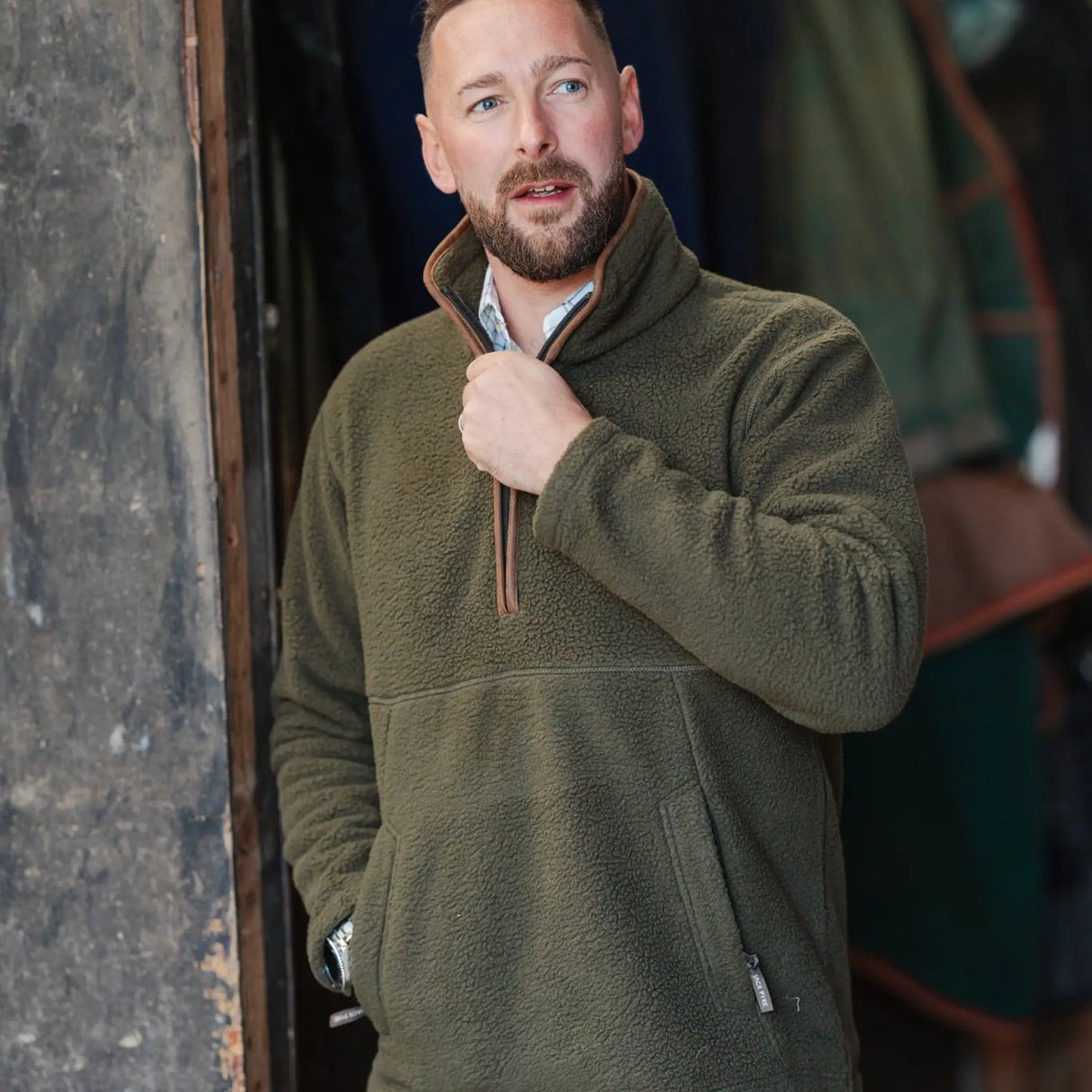 Jack Pyke Half Zip Sherpa Fleece Pullover on a man working on a farm