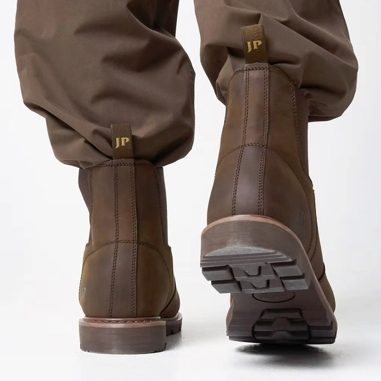 Jack Pyke Shires Dealer Boots in borwn from the side stepping on white background