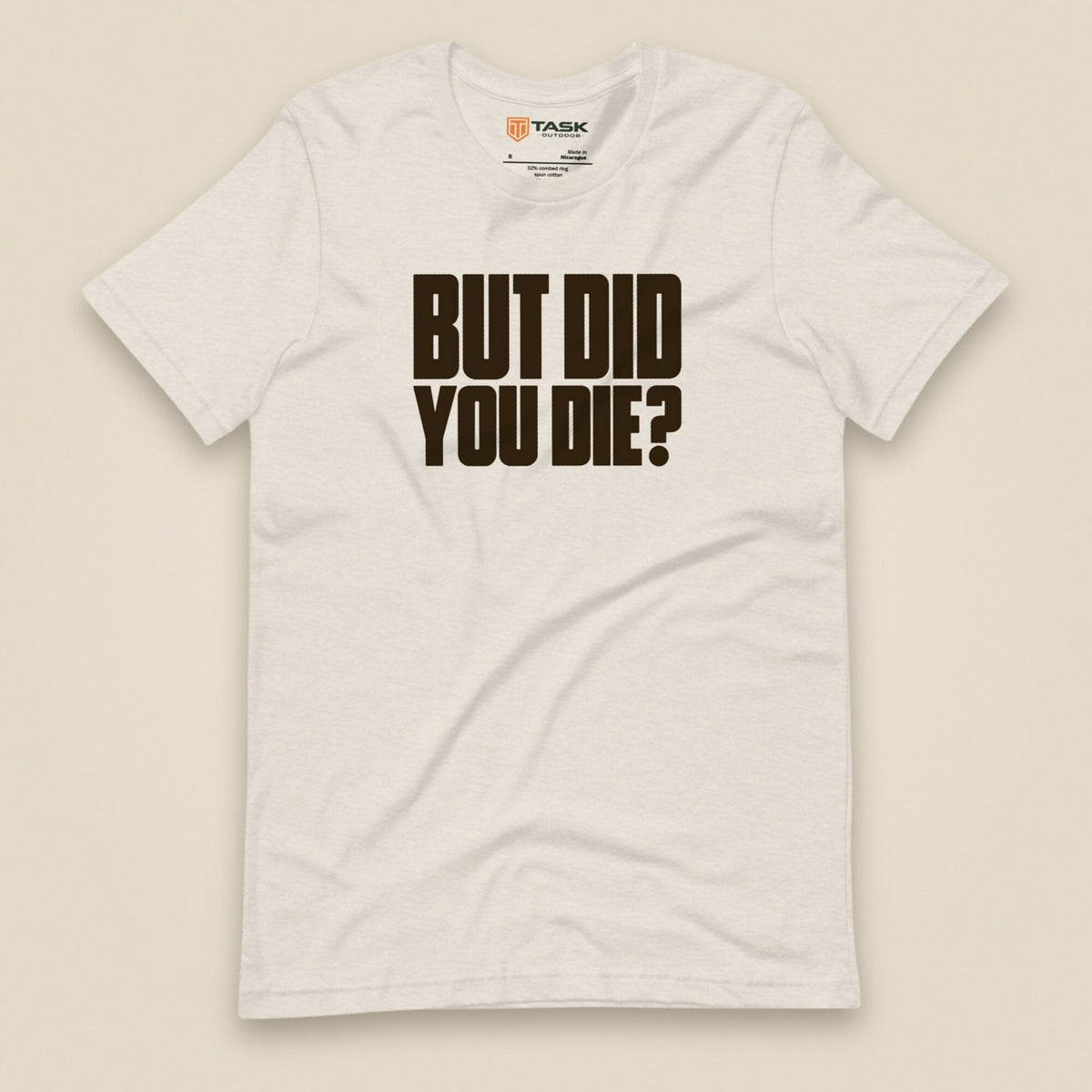 But Did You Die? Unisex T-Shirt in Heather Dust, front view
