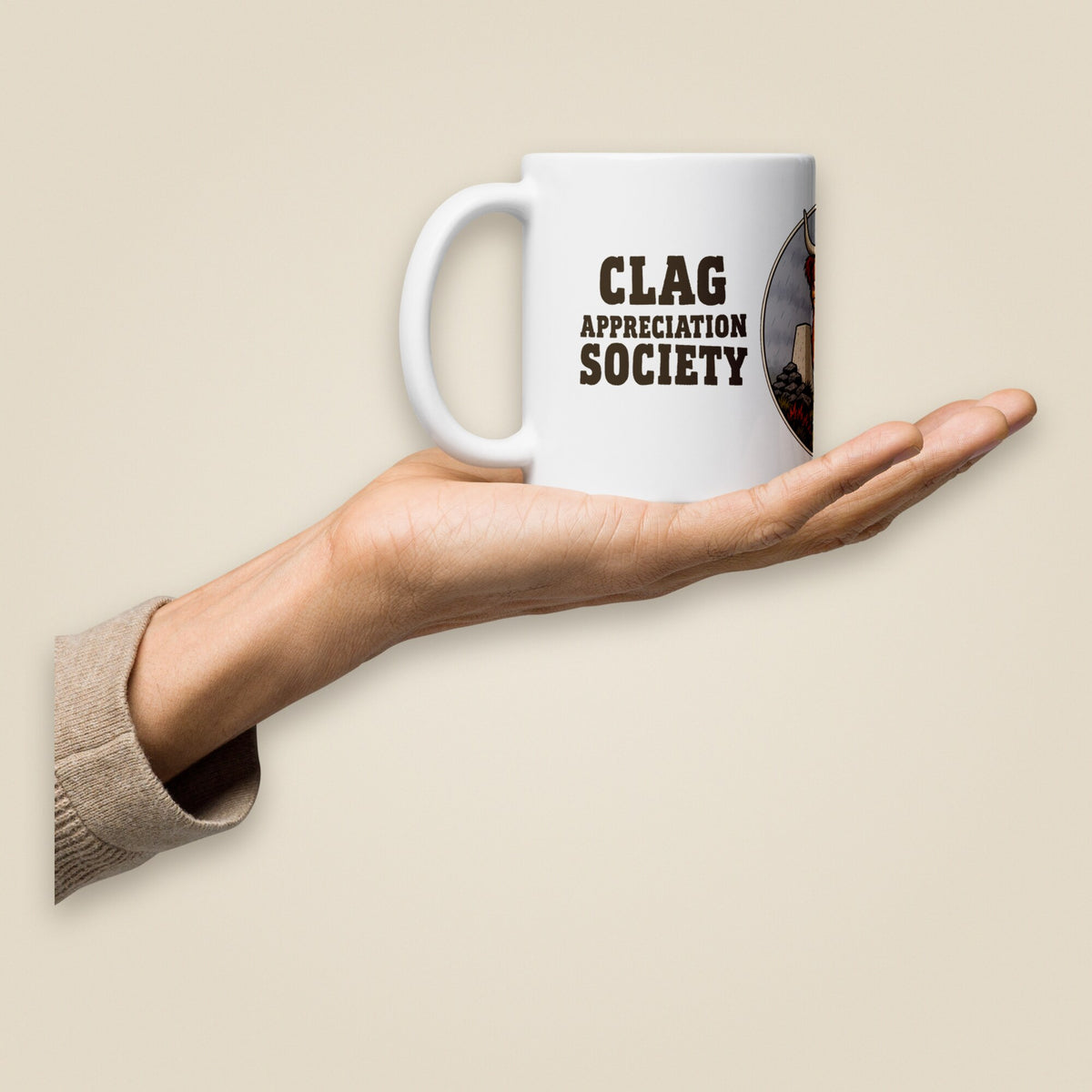 Clag Appreciation Society White Glossy Ceramic Mug in 11 oz, held in hand, handle on left