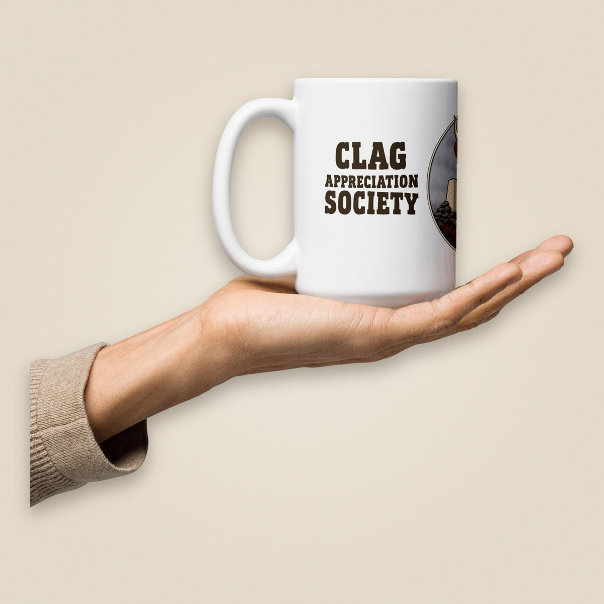 Clag Appreciation Society White Glossy Ceramic Mug in 15 oz, held in hand, handle on left