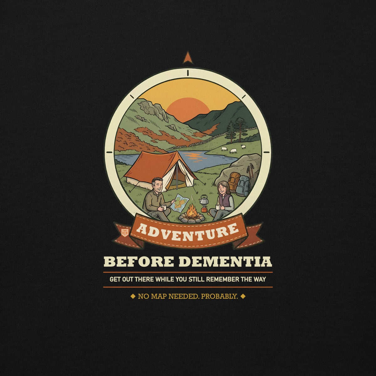 Close-up of the Adventure Before Dementia Camping Hoodie print in Black: a couple by a campfire next to an orange tent beside a lake, with sheep, hills and a low sun inside a compass badge