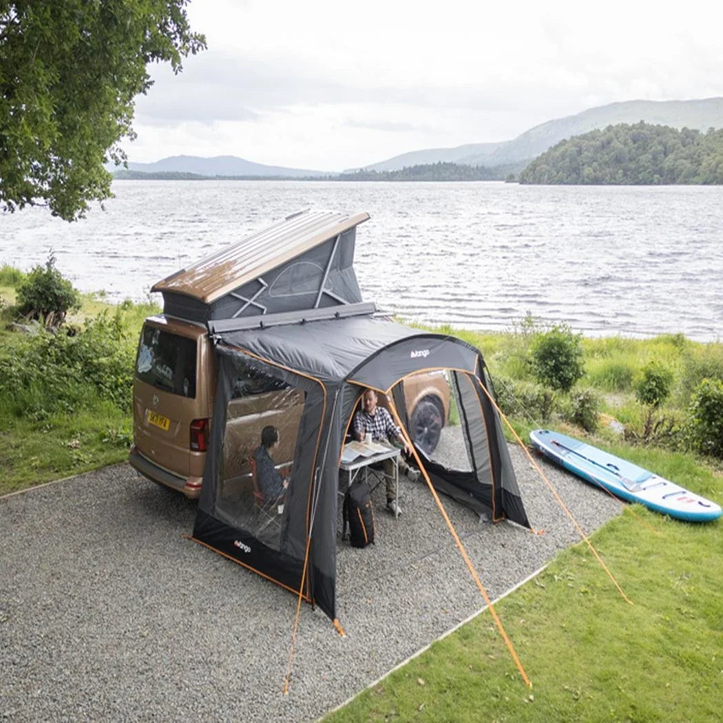 Vango Sunlight awning on a pop-top campervan beside a lake