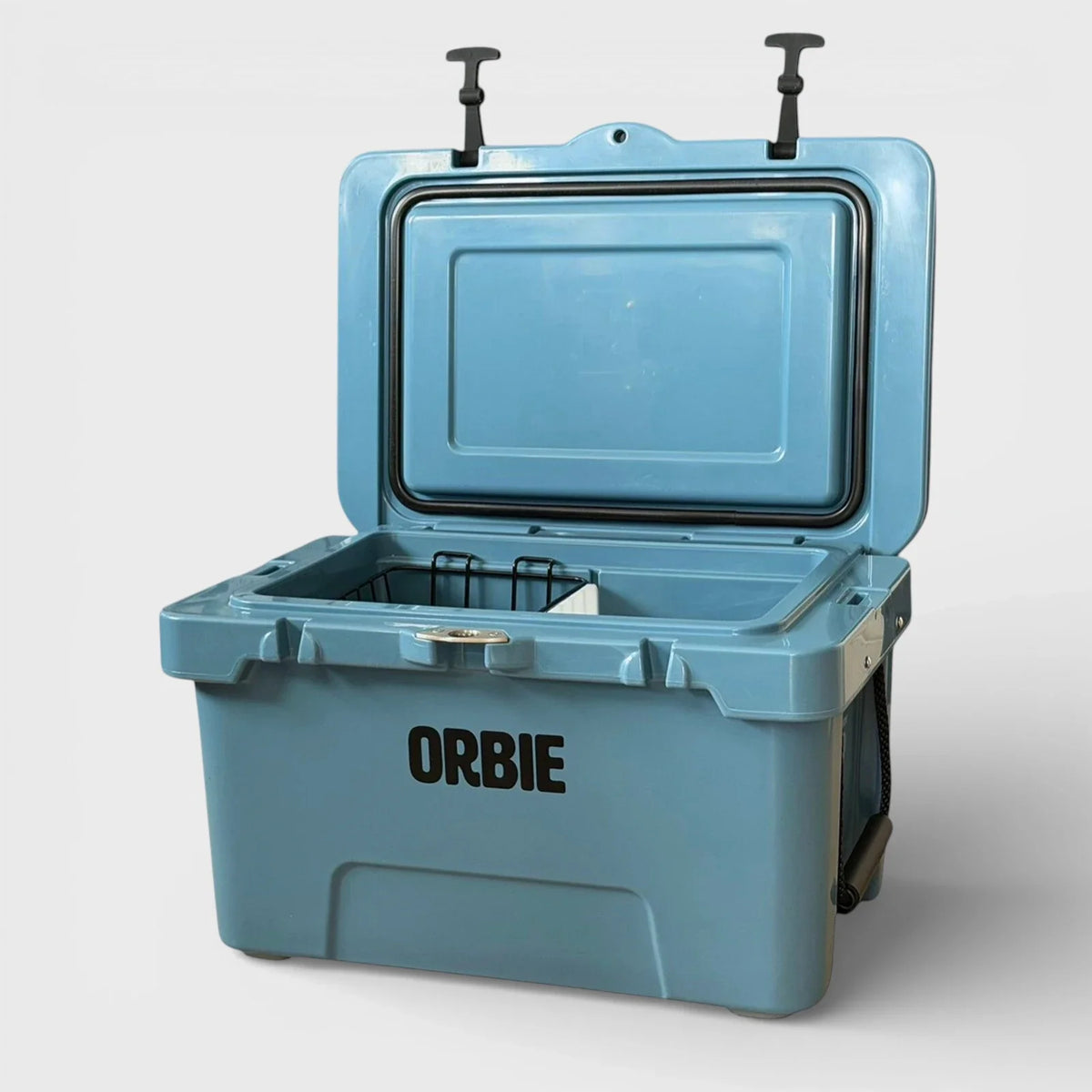 Orbie 35 cool box in Mountain Blue open at an angle, showing the rubber lid seal, wire basket and divider
