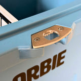 Close-up of the brass bottle opener bolted into the front lip of the Orbie 35 cool box