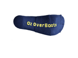 Close-up of the cushioned sole of a navy sock with yellow Oz OverBoots lettering