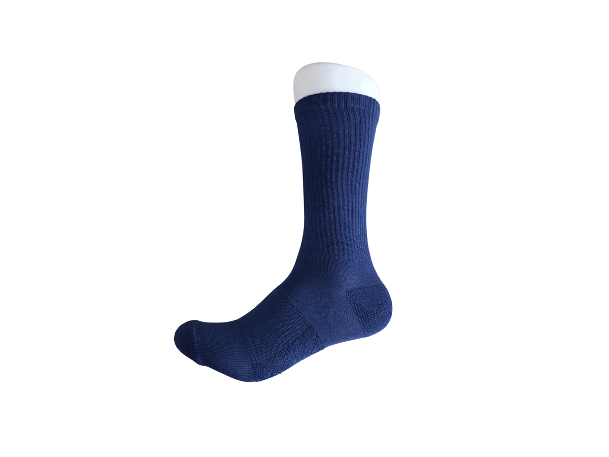 Navy Oz OverBoots merino wool blend crew sock on a foot form, side view