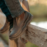 Mongrel 940030 Elastic Side Premium Chelsea Boot - Brown worn outdoors resting on a timber fence rail