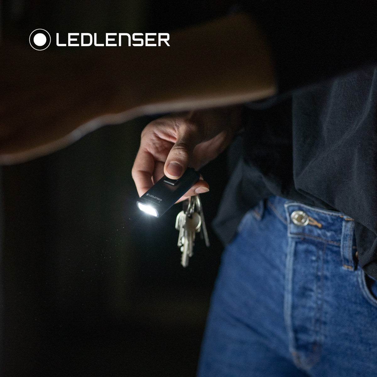 Ledlenser K6R Safety on a bunch of keys lighting a door lock at night