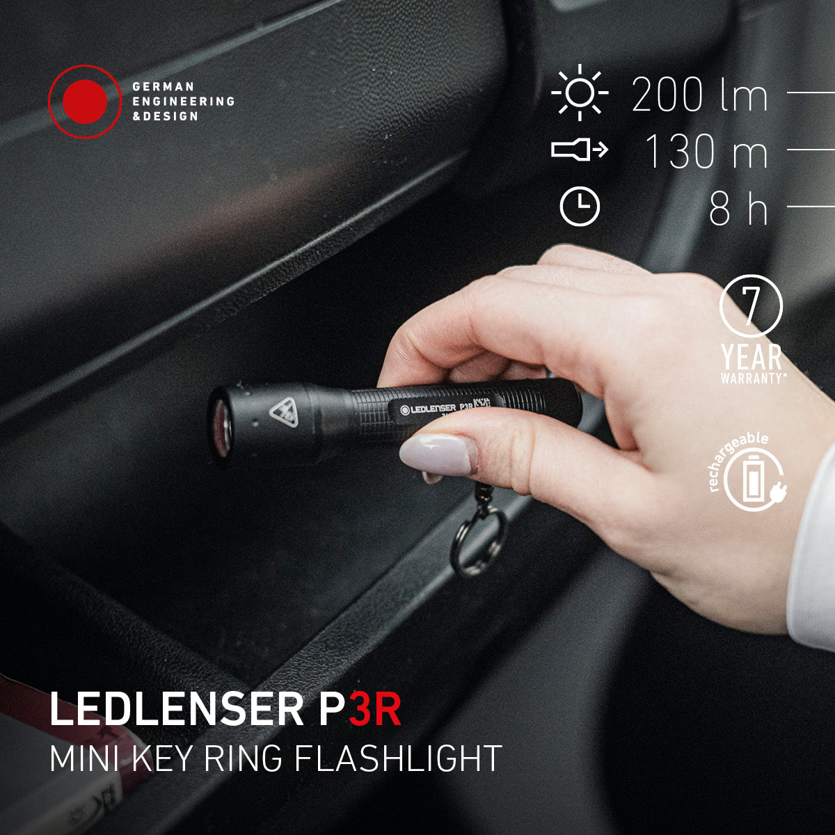 Hand using the Ledlenser P3R keyring torch inside a car