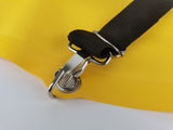 Close-up of a harness strap snap hook and buckle on the yellow PVC pack