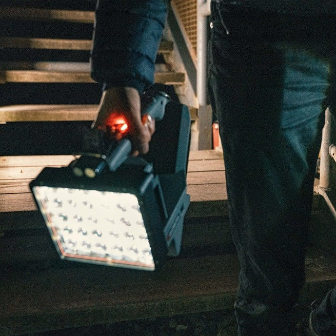 Hand carrying the Ledlenser XP30R down wooden steps at night