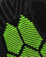 Close-up of the Enertor Energy Run sock knit and green honeycomb panel