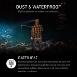 Angler on wet rocks at night lit by a Ledlenser head torch, rated IP67 dust and waterproof