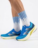 Runner's lower legs in Stride Infinite Blue half crew running socks with blue running shoes