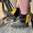 Yellow and black harlequin sox savers worn over dealer boots