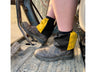 Yellow and black harlequin sox savers worn over dealer boots